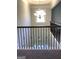 View of the staircase from second story looking down to the front door at 160 Elysian Dr, Fayetteville, GA 30214