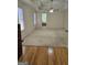 Spacious bedroom with a ceiling fan, natural light, and doorway view into an en-suite bathroom at 45 Anna Dr, Covington, GA 30014
