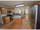 Bright kitchen with stainless steel appliances, center island, oak cabinetry, and an open layout at 45 Anna Dr, Covington, GA 30014