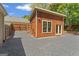 Backyard of this home features a shed or outbuilding with a gravel area at 421 Bear Cub Path, Social Circle, GA 30025