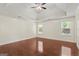 Spacious bedroom with trey ceilings, ceiling fan, hardwood floors, and natural light from windows at 421 Bear Cub Path, Social Circle, GA 30025