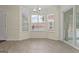 Bright breakfast nook with large windows, neutral walls, and tile floors, bathed in sunlight at 421 Bear Cub Path, Social Circle, GA 30025