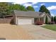 Beautiful single-story home with a well-manicured front yard and two car garage at 421 Bear Cub Path, Social Circle, GA 30025