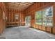 Spacious shed interior with concrete floor, exposed studs, work bench and windows at 421 Bear Cub Path, Social Circle, GA 30025