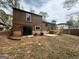 This home includes a backyard with a patio, deck, and sliding glass doors at 862 Bridgewater Ct, Stone Mountain, GA 30088
