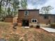 Backyard view of the house featuring a walkout basement at 862 Bridgewater Ct, Stone Mountain, GA 30088