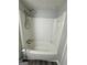 An enclosed bathtub and shower with bright white finishes at 862 Bridgewater Ct, Stone Mountain, GA 30088