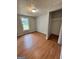 Bedroom with hardwood floors and a bright window at 862 Bridgewater Ct, Stone Mountain, GA 30088