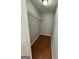 A well-organized walk-in closet with custom shelving and laminate flooring at 862 Bridgewater Ct, Stone Mountain, GA 30088