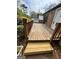 Spacious deck with brown wood planking and a brown wood railing at 862 Bridgewater Ct, Stone Mountain, GA 30088