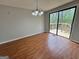 The dining room features natural lighting and hardwood floors that lead to the outdoor deck at 862 Bridgewater Ct, Stone Mountain, GA 30088