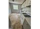 Kitchen with white and gray cabinets and view of the private backyard at 862 Bridgewater Ct, Stone Mountain, GA 30088