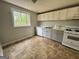 Spacious kitchen with white and gray cabinets and new appliances at 862 Bridgewater Ct, Stone Mountain, GA 30088