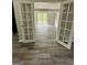 Living room with updated vinyl flooring leading to an outdoor green space at 862 Bridgewater Ct, Stone Mountain, GA 30088