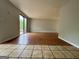 Living room with hardwood floors and sliding glass doors to the deck at 862 Bridgewater Ct, Stone Mountain, GA 30088