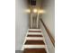 Stairway with wooden steps and a classic banister, leading to the upper level at 862 Bridgewater Ct, Stone Mountain, GA 30088