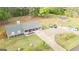 Home with a long driveway and ample parking, complimented by lush landscaping and a neighboring small cottage at 140 Stoneview Cir, Covington, GA 30016