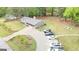 Expansive property showcases a well-kept home with lush green lawns and a long driveway with plenty of parking at 140 Stoneview Cir, Covington, GA 30016