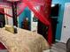 Bedroom featuring a bed with decorative pillows, turquoise walls and canopy at 140 Stoneview Cir, Covington, GA 30016