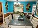 Eat-in kitchen featuring a large dining table with view of the backyard at 140 Stoneview Cir, Covington, GA 30016