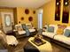 Comfortable living room with sofas, yellow walls and decor creating a warm and inviting space at 140 Stoneview Cir, Covington, GA 30016