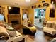 Open-concept living room with fireplace, comfortable seating, and seamless flow to kitchen at 140 Stoneview Cir, Covington, GA 30016