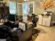 Bright office with tiled floor, computer, plants, and white french doors leading to an outdoor area at 140 Stoneview Cir, Covington, GA 30016