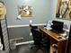 Inviting office space with a modern desk setup, natural light, and practical organization at 140 Stoneview Cir, Covington, GA 30016