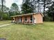Cozy outbuilding with a covered porch, perfect for a guest house or private retreat at 140 Stoneview Cir, Covington, GA 30016