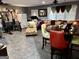 Spacious room with exercise equipment, seating area, dining table and tiled floor at 140 Stoneview Cir, Covington, GA 30016
