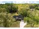 Beautiful home nestled among lush greenery, boasting a long driveway and a large three-car garage at 145 Carrington Ln, Brooks, GA 30205