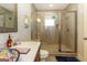 Modern bathroom with a glass-enclosed shower and stylish fixtures and a decorative vessel sink at 145 Carrington Ln, Brooks, GA 30205
