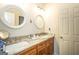 This bathroom has a dual sink vanity with granite counters and framed mirrors at 145 Carrington Ln, Brooks, GA 30205