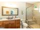 Charming bathroom featuring a vessel sink, marble countertops, and a glass-enclosed tiled shower at 145 Carrington Ln, Brooks, GA 30205