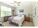 This bedroom features a large window, carpeted floors, and traditional furnishings at 145 Carrington Ln, Brooks, GA 30205