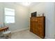 Cozy bedroom with dresser and window offers a serene and inviting atmosphere at 145 Carrington Ln, Brooks, GA 30205
