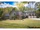 Lovely home with a three-car garage, well-kept lawn, and a welcoming facade at 145 Carrington Ln, Brooks, GA 30205
