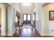 Inviting foyer with hardwood floors, high ceilings, and an elegant doorway with double doors at 145 Carrington Ln, Brooks, GA 30205