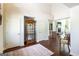 Spacious foyer with dark hardwood flooring, high ceilings, and views into the living room with fireplace at 145 Carrington Ln, Brooks, GA 30205