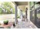 Charming front porch with stone flooring, potted plants, and ample space for relaxation at 145 Carrington Ln, Brooks, GA 30205