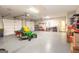 This spacious three-car garage features epoxy floors and plenty of room for storage at 145 Carrington Ln, Brooks, GA 30205