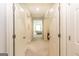 Bright hallway with multiple doorways leading to bedrooms, creating a sense of space and openness at 145 Carrington Ln, Brooks, GA 30205