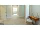 Hallway leading to the bathroom featuring neutral paint and modern design at 145 Carrington Ln, Brooks, GA 30205