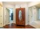 Elegant hallway featuring hardwood floors and a vintage-style armoire with a mirror and carved details at 145 Carrington Ln, Brooks, GA 30205