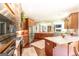 Gourmet kitchen with stainless steel appliances, wood cabinets, and granite counters open to the living area at 145 Carrington Ln, Brooks, GA 30205