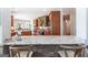 Gourmet kitchen with stone accents, granite counters, and bar seating at 145 Carrington Ln, Brooks, GA 30205