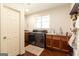 This laundry room features built-in cabinetry, granite counters, and modern appliances at 145 Carrington Ln, Brooks, GA 30205