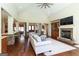 Spacious living room features a stone fireplace, hardwood floors, and an open floor plan at 145 Carrington Ln, Brooks, GA 30205