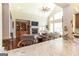 Well-appointed living room with fireplace, built-ins, and open access to kitchen at 145 Carrington Ln, Brooks, GA 30205