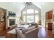 Open-concept living area with hardwood floors, fireplace, and ample natural light at 145 Carrington Ln, Brooks, GA 30205